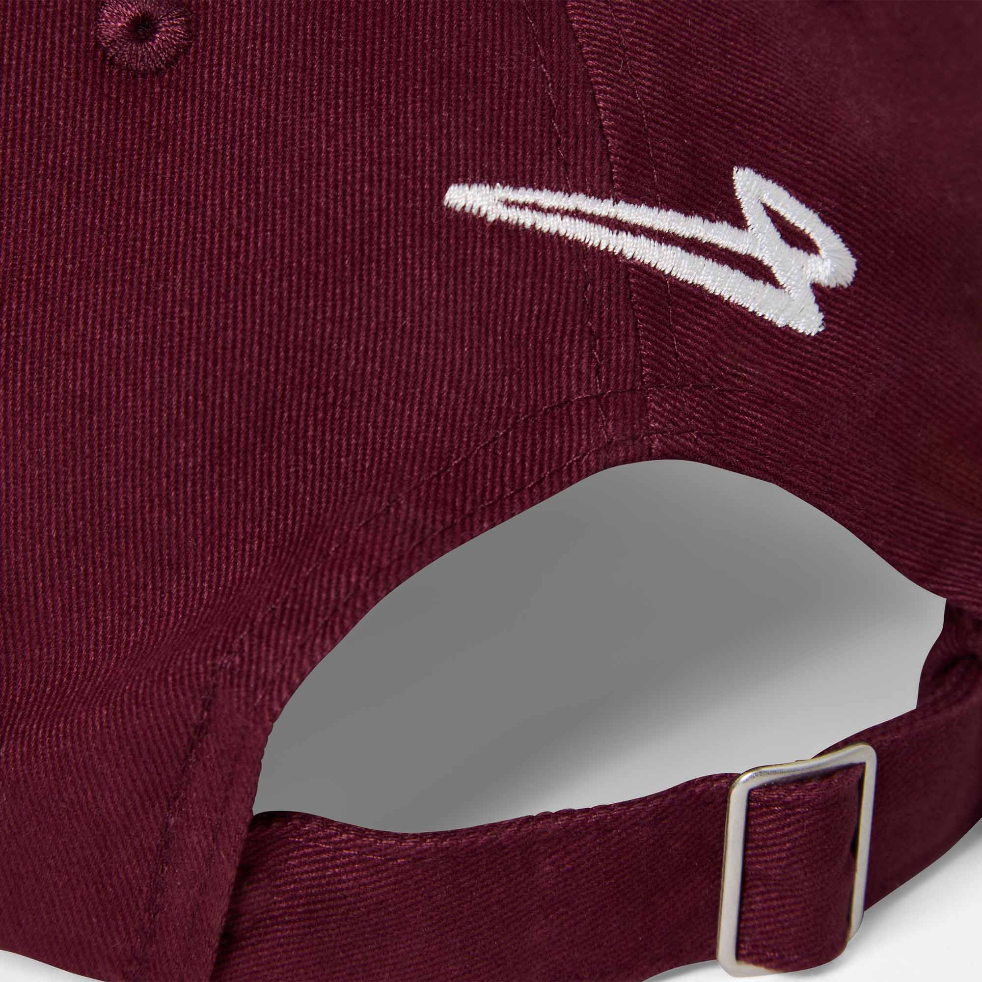 Close-up of the Lanzera Club Cap in Burgundy showing the embroidered Flying Four logo and metal strap buckle.