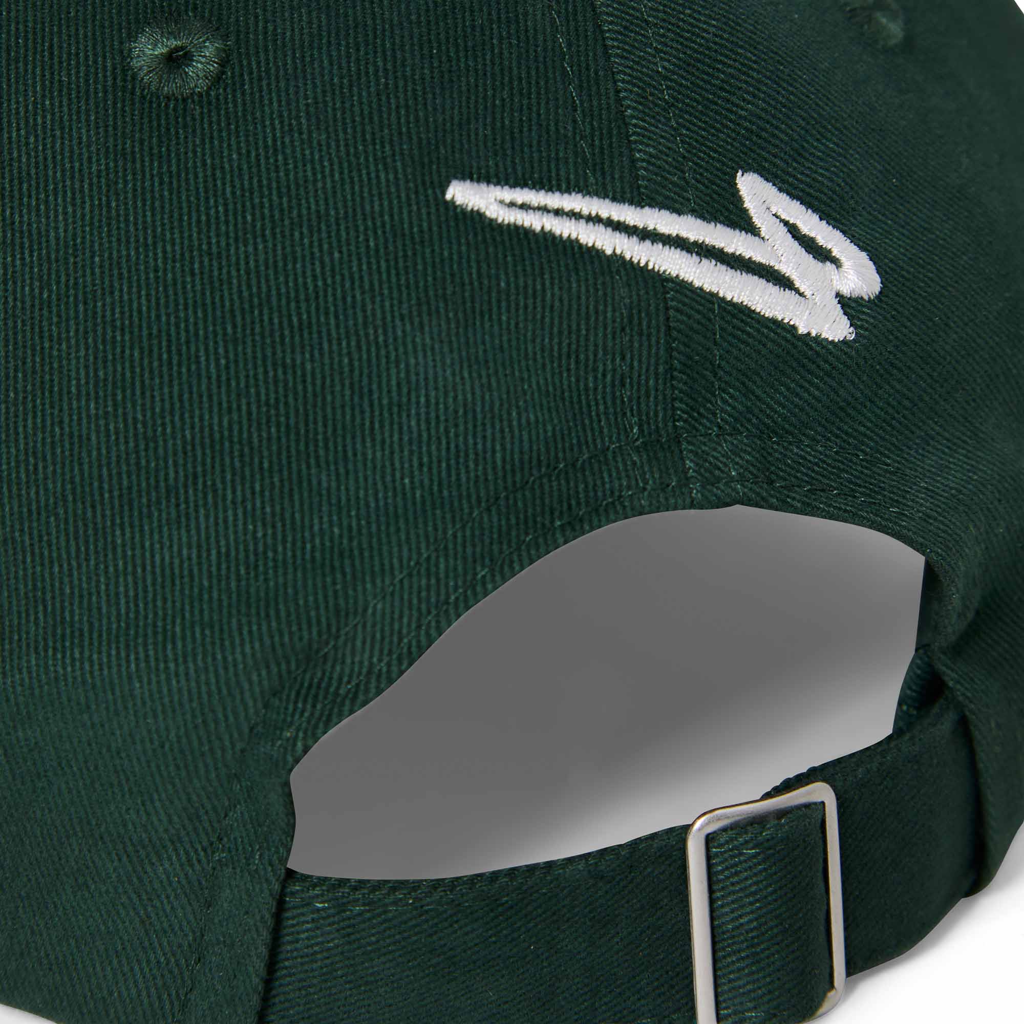 Close-up of the Lanzera Club Cap in Hunter Green showing the embroidered Flying Four logo and metal strap buckle.