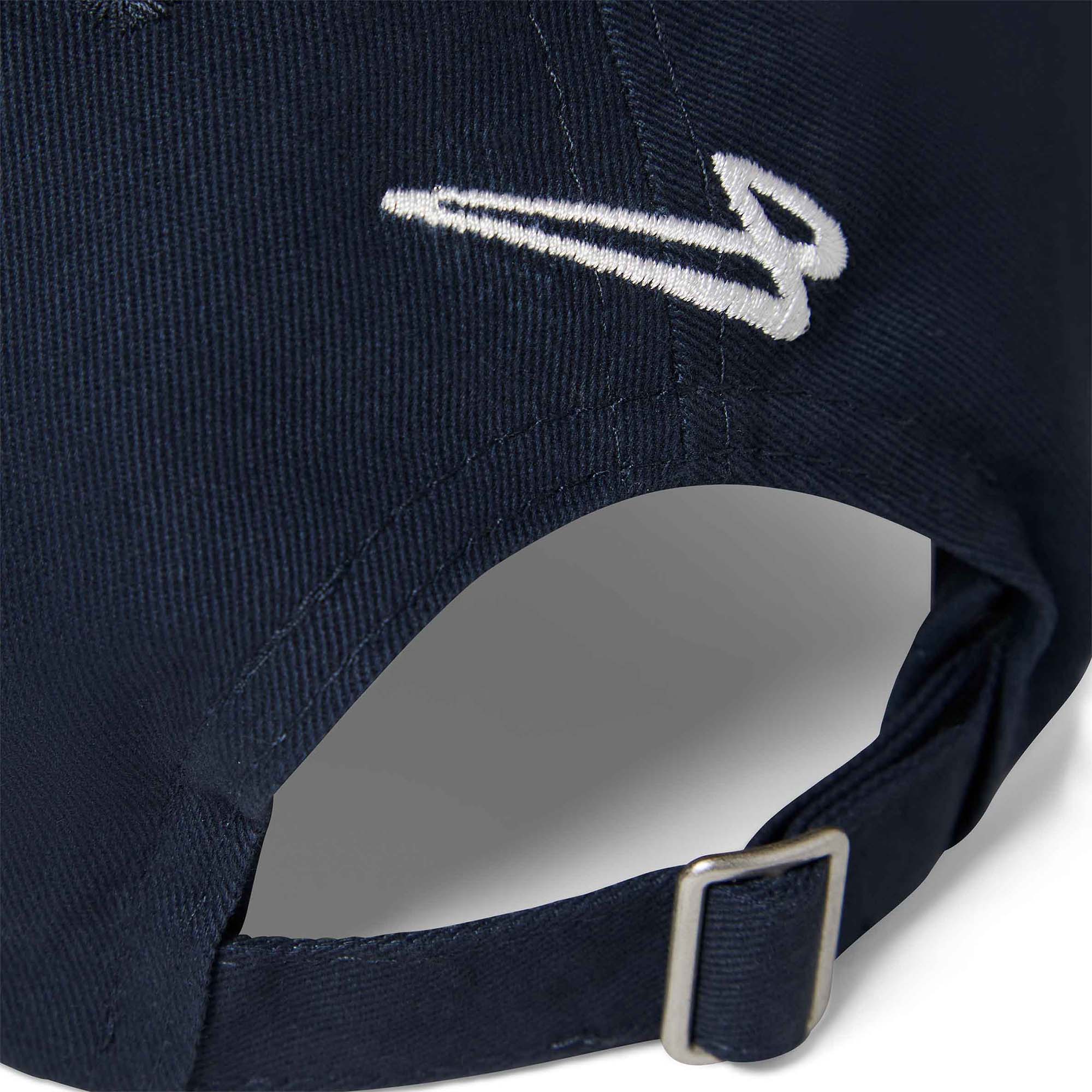 Close-up of the Lanzera Club Cap in Navy showing the embroidered Flying Four logo and metal strap buckle.
