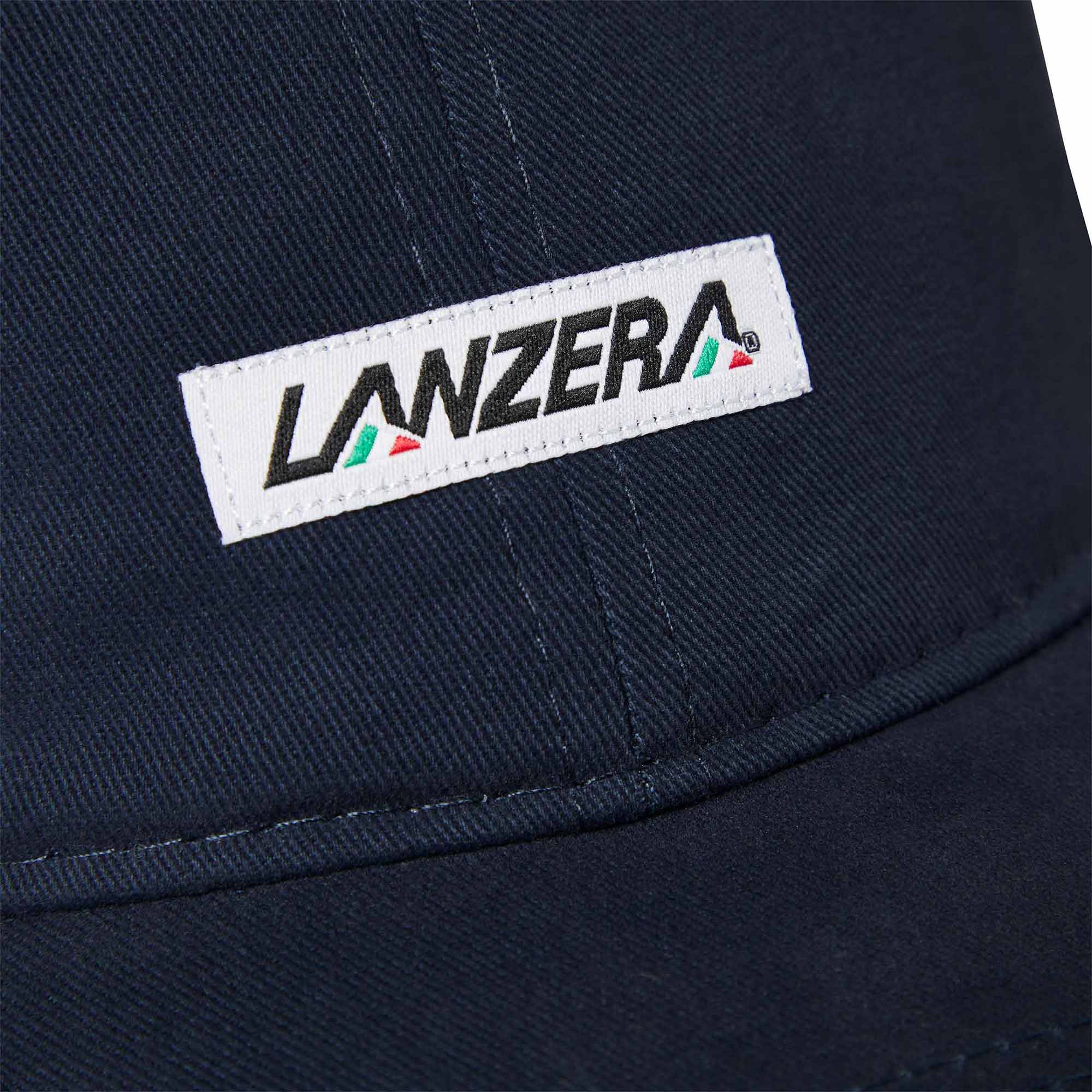 Close-up of the Lanzera Club Cap in Navy showing the stitched Lanzera club patch with red, green, and black detailing.