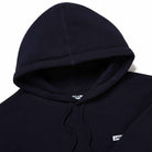 Close-up of logo patch, hood, and fabric on Lanzera Club Hoodie in Navy Clásico.