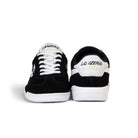 Front and back view of Lanzera Jackal Black indoor shoes with suede upper and white sole.