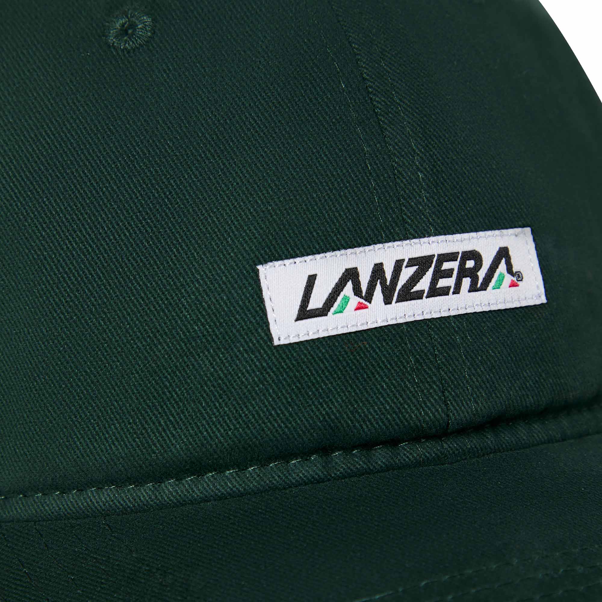 Close-up of the Lanzera Club Cap in Hunter Green showing the stitched Lanzera club patch with red, green, and black detailing.