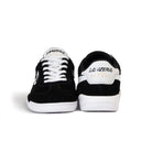 Front and back view of the Lanzera Jackal black suede leather sneakers, displaying the laced front and heel logo with gold Jackal branding.