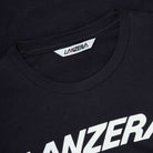 Close-up of the Lanzera Tee in black, showcasing the bold white Lanzera logo printed across the chest. The ribbed collar and reinforced stitching ensure long-lasting wear and premium quality.