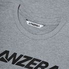 Close-up of the Lanzera Tee in Grey, highlighting the finely stitched ribbed collar and bold Lanzera logo printed in black across the chest. The premium cotton-polyester blend ensures breathability and long-lasting softness for a stylish yet functional look.